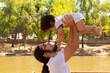 © Antonio Tanaka - portrait of a Hispanic father and baby in a park smiling and having fun