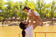 © Antonio Tanaka - portrait of a Hispanic father and baby in a park smiling and having fun