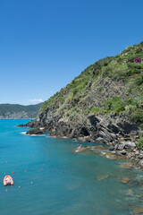 natural view of a beautiful rocky island in italy under a clear blue sky