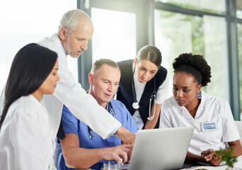 Poster - Your health is of the utmost importance. Shot of doctors in a hospital.