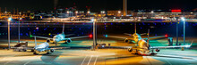 Banner Image Of Lined Up Airplanes At The Aiport At Night.