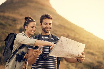 Sticker - Were right here. Shot of a couple looking at a map while out hiking.