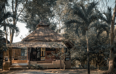 Beautiful view of Summer wooden cottage or Summer wooden bungalow surrounded by a beautiful tropical park. Selective focus.