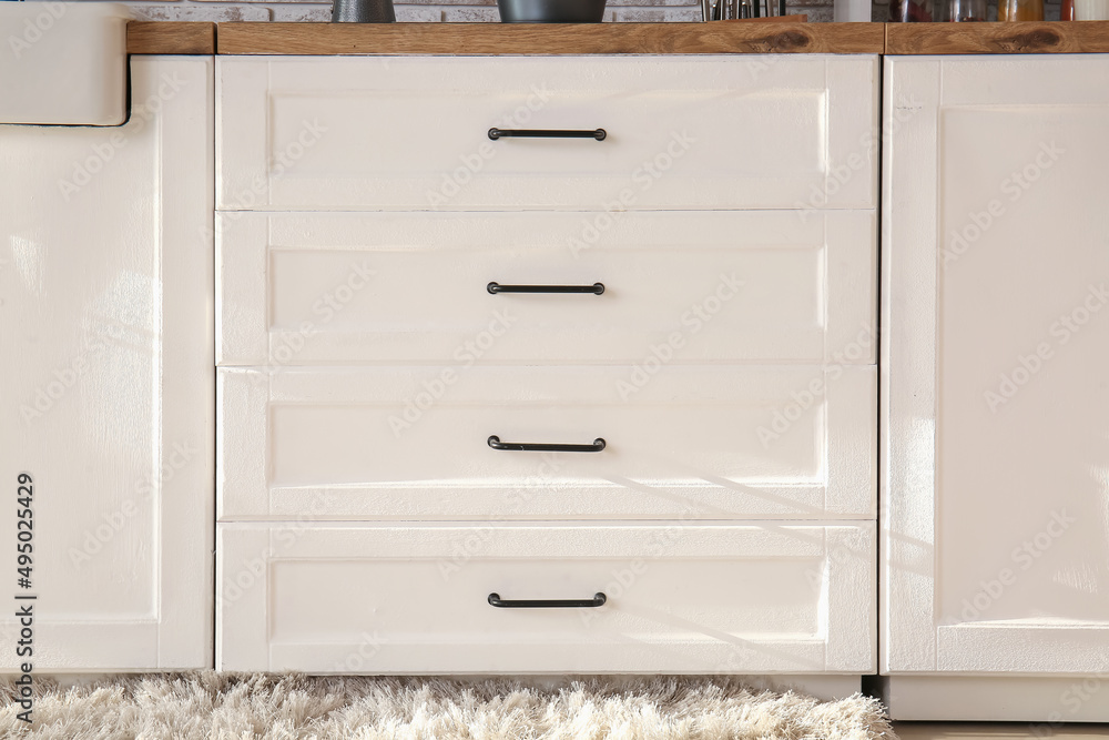 White counter with drawers in kitchen