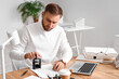 © Pixel-Shot - Male notary public attaching seal to document in office