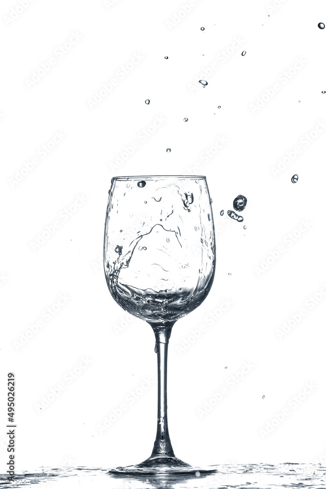 Glass of clean water with splash on white background
