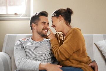 Canvas Print - Youre all mine today. Cropped shot of a young couple relaxing on the sofa at home.