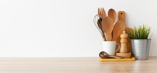 Kitchen utensils background with,cutboard, bowls on the table on white background. Blank space for a text, home kitchen decor concept.