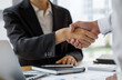 © David - Business handshake for teamwork of business merger and acquisition,successful negotiate,hand shake,two businessman shake hand with partner to celebration partnership and business deal concept