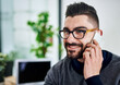 © Camerene Pendl/peopleimages.com - Sure, lets arrange to meet. Shot of a young designer talking on a cellphone in an office.