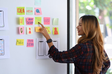 Wall Mural - ux designer planning new website wireframe at creative office.