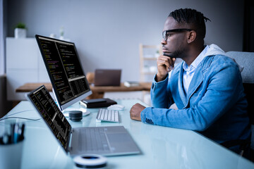 software programmer coder working on computer