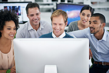 Sticker - No blue Mondays in this office. Shot of a group of creative businesspeople working together on a computer in the office.