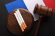 Flag of France, cigarettes and Judge gavel top view. Tobacco control act. government duty. Justice and Tobacco law.