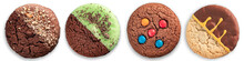 Various Chocolate-covered Cookies Isolated On A White Background. Oatmeal Cookies With Chocolate, Mint, Icing And Sweets