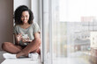© kite_rin - Young woman resting at home with smartphone, beautiful girl looking at phone panoramic banner, Online communication, relaxation, connection, social distancing, technology, leisure lifestyle concept
