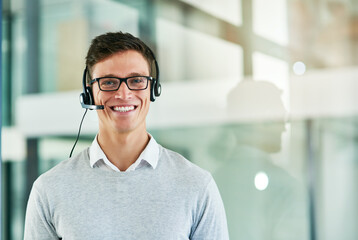 Sticker - Theres no query he cant handle. Portrait of a young call center agent working in an office.