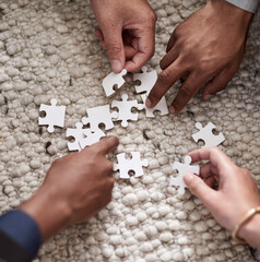 Sticker - Pulling together to solve a problem. Cropped shot of a group of people fitting puzzle pieces together.