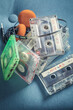 Stack of transparent audio cassettes with headphones
