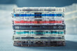 Old pile of transparent cassette tapes on blue sofa