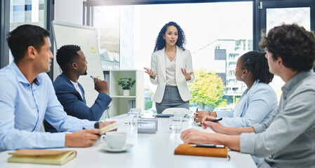Wall Mural - weve received some feedback on our campaign. shot of a young businesswoman giving a presentation to 