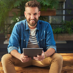 Poster - I cant survive without social media at my side. Portrait of a handsome young man using a digital tablet.