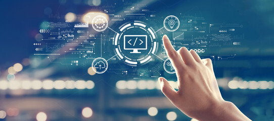 Web development concept with hand pressing a button on a technology screen