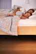 © Yuri A for PeopleImages/peopleimages.com - Getting a peaceful night of rest. A couple sleeping in their bed.