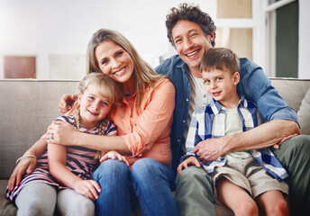 Poster - The love of a family. Portrait of a happy family bonding together at home.