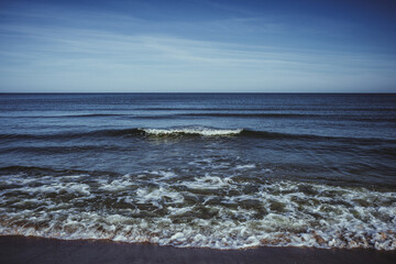 Wall Mural - Tranquil seascape with calm sea and blue sky