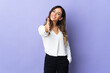 © luismolinero - Young caucasian woman isolated on purple background shaking hands for closing a good deal