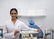 © K Seisa/peopleimages.com - Oral health is an essential part of a healthy life. Portrait of a young female dentist sitting alongside a tray of surgical instruments in her office.