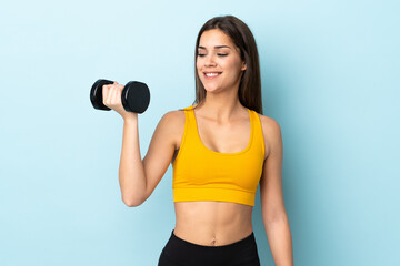 Poster - Young caucasian woman making weightlifting isolated on blue background with happy expression