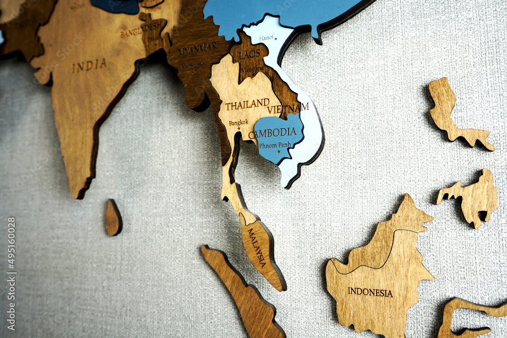 Asia on the political map. Wooden world map on the wall. Thailand ...