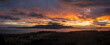 © LoweStock - Aerial Panoramic View of Orcas Island During a Dramatic Sunset. Seen from neighboring Lummi island looking across Rosario Strait at the sun dropping below the dynamic cloudscape.