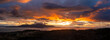 © LoweStock - Aerial Panoramic View of Orcas Island During a Dramatic Sunset. Seen from neighboring Lummi island looking across Rosario Strait at the sun dropping below the dynamic cloudscape.