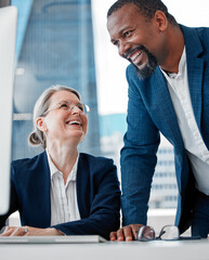 I think youve got this all under control. Shot of two businesspeople having a discussion in the office while using a computer.