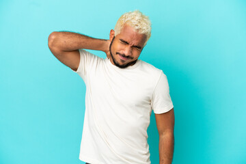 Poster - Young Colombian handsome man isolated on blue background with neckache