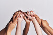 © Katleho Seisa/peopleimages.com - Diversified as a whole. Shot of a group of hands holding on to each other against a white background.