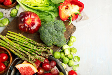 Wall Mural - Delicious raw fruits and vegetables on light background.