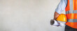 © theevening - Architect man holding helmet and project paper plan with concrete backgrounds, image panorama for cover design.