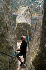 person climbing a rock