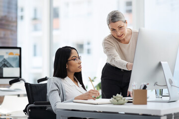 Showing her the ropes. Cropped shot of an attractive young businesswoman getting some information from her human resources manager in the office.