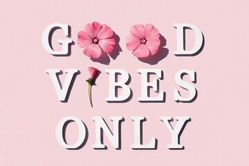 Wall Mural - Good vibes only. Motivational quote from white letters and beauty natural flowers on pink background. Creative concept inspirational quote of the day