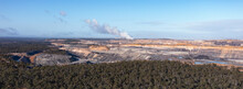 Panoramic Image Of Open Cut Coal Mine And Power Station In Distance