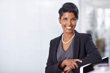 Shes got it all under control. Shot of an attractive young woman businesswoman in her office.