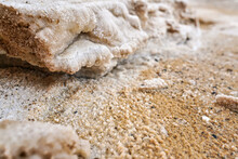 Sand And Stones Covered With Crystalline Salt Crust On Shore Of Dead Sea, Closeup Detail