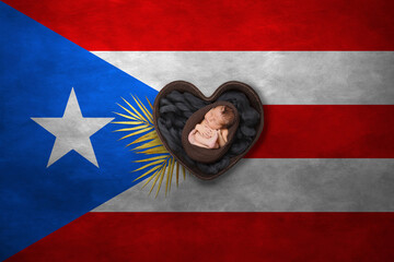 Newborn portrait in heart on background of national flag. Photography peace concept. Puerto Rico