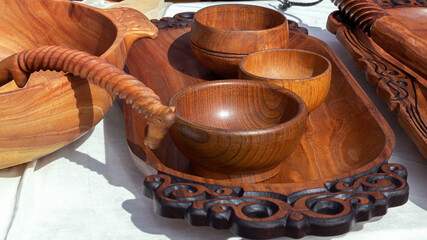 Wall Mural - Traditional wooden utensils are sold at a street stall. Handmade