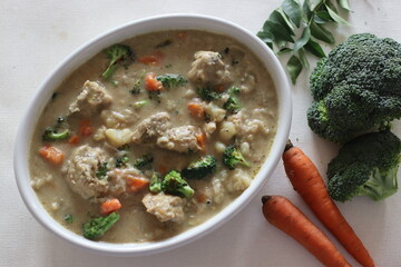 Wall Mural - Stewed chicken with vegetables. Kerala style preparation with carrots, broccoli, potato, chicken, coconut milk and spices